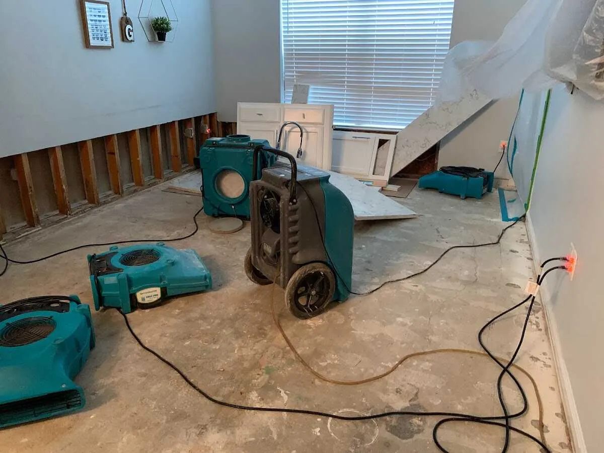 Dehumidifier in flood-cut room for Water Damage Restoration in Charlton